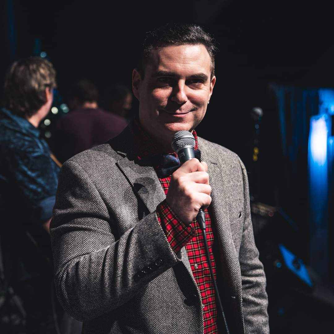 Darryl Hillock speaking on stage